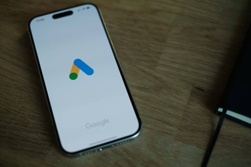 Mobile device with Google Ads logo, symbolising digital advertising and PPC campaigns.